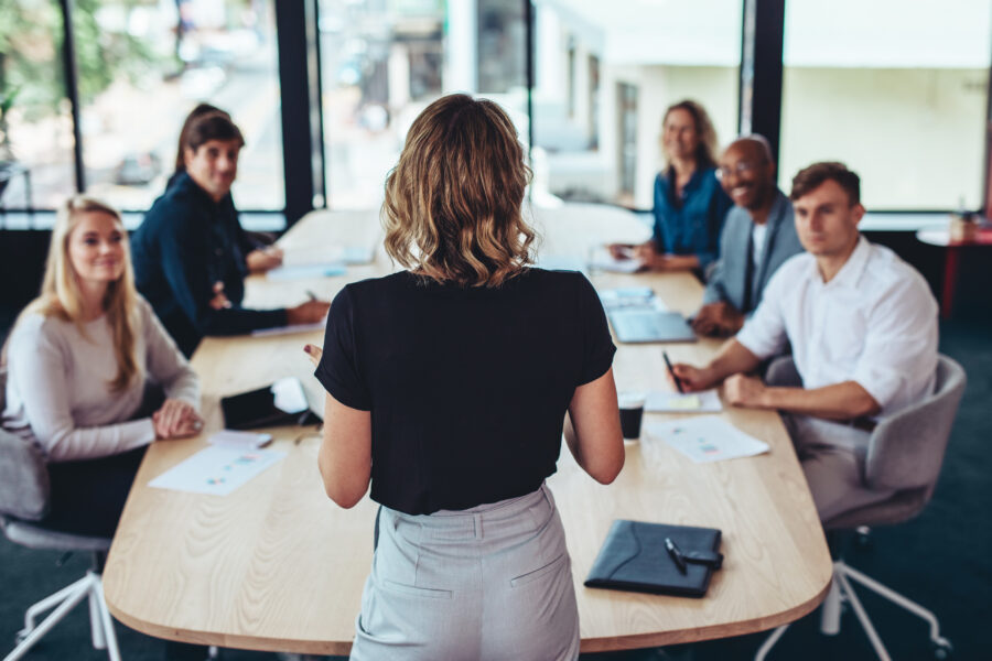 Woman leading a conference room meeting blog image