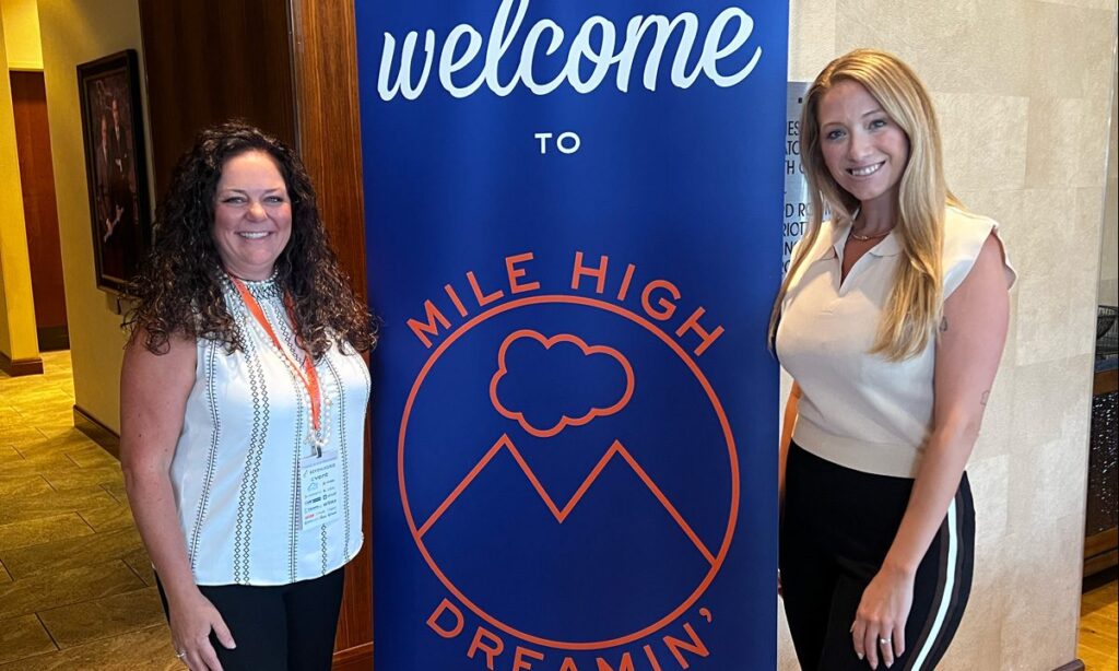 Stephanie & Sarah at Mile High Dreamin' welcome sign