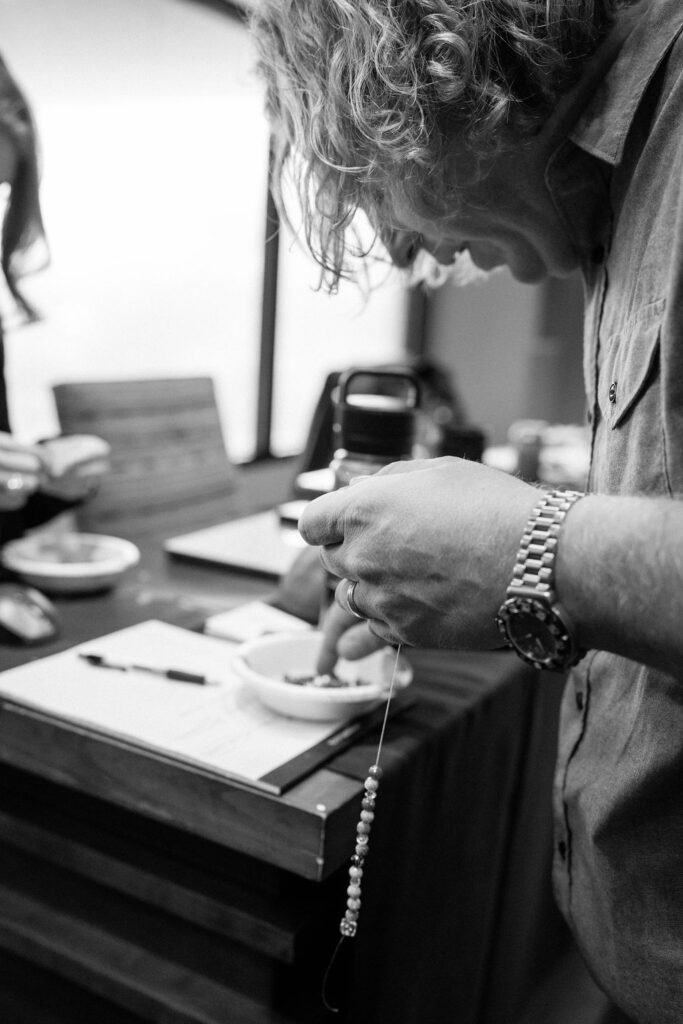 Chris making a necklace