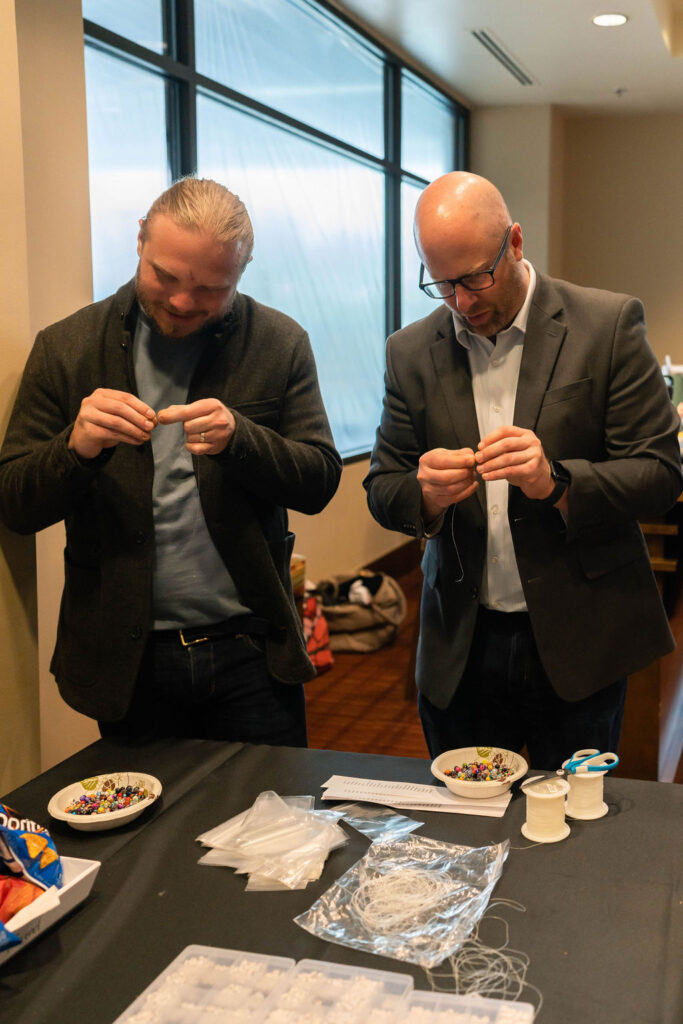 Sean and Jordan working hard at trying to make necklaces