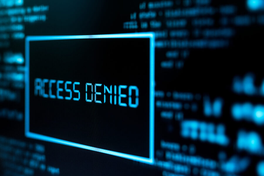 Photography of motinor screen with inscription Access denied. Cybercrime concept.
