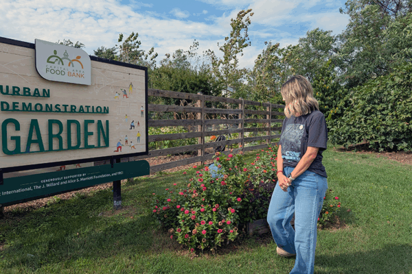 Sarah Burt looking at the CAFB signage