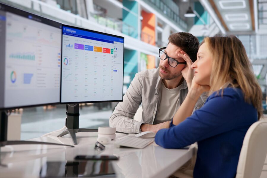 Two people staring at their CRM system